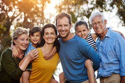 Photograph of a family with three generations of smiles from Lakewood Dental Arts in Lakewood, CA