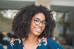 Beautiful female patient with traditional braces from Lakewood Dental Arts in Lakewood, CA