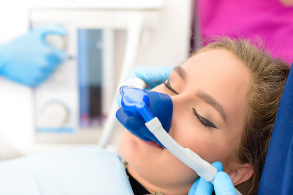 Sedated woman in dental chair from Lakewood Dental Arts in Lakewood, CA