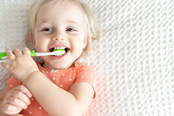 Happy little girl getting ready for her dental exam at Lakewood Dental Arts in Lakewood, CA