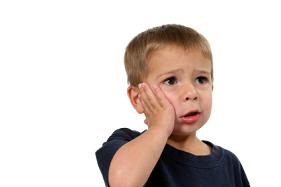 Boy with tooth pain.